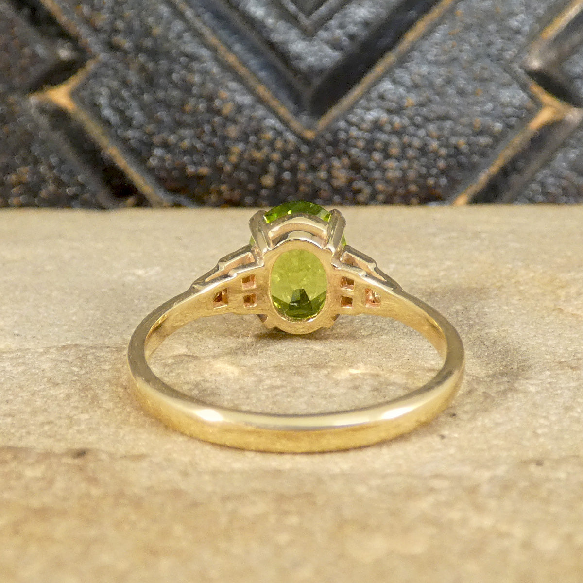 Fully crafted in Yellow Gold with an open basket gallery to allow light to pass through making the Peridot green colour pop.