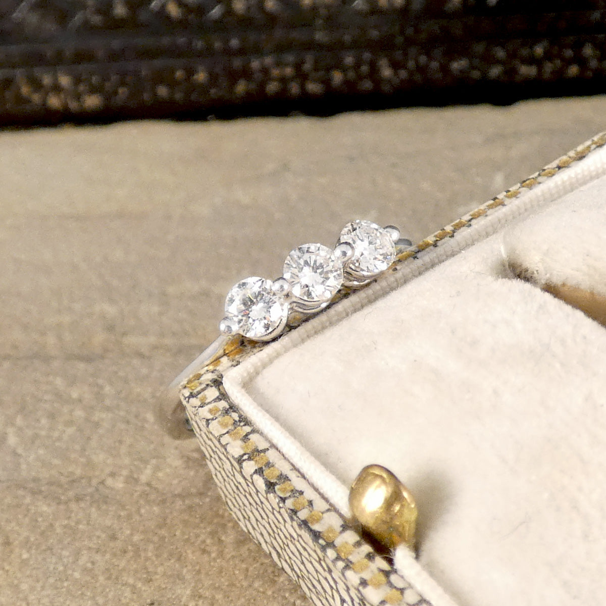 Three equally sized Diamonds set into a simple and minimal setting in white gold, the perfect gift and engagement ring.