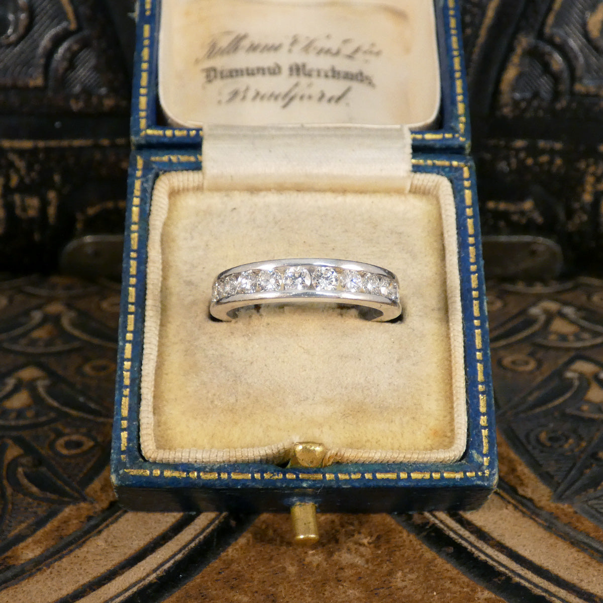 0.75ct Diamond Channel Set Half Eternity Ring in Platinum spreading half way around the finger making the perfect wedding ring and stackable ring. Displayed in box.
