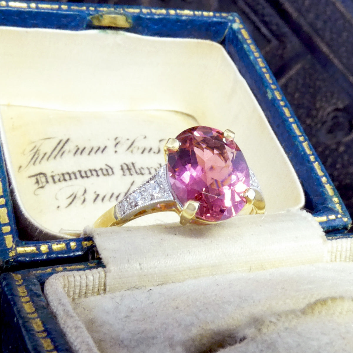 Showcasing a gorgeous colour, this pink tourmaline ring is shown in a vintage box.