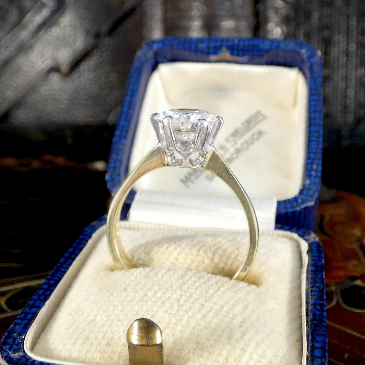 Side profile of diamond solitaire ring.