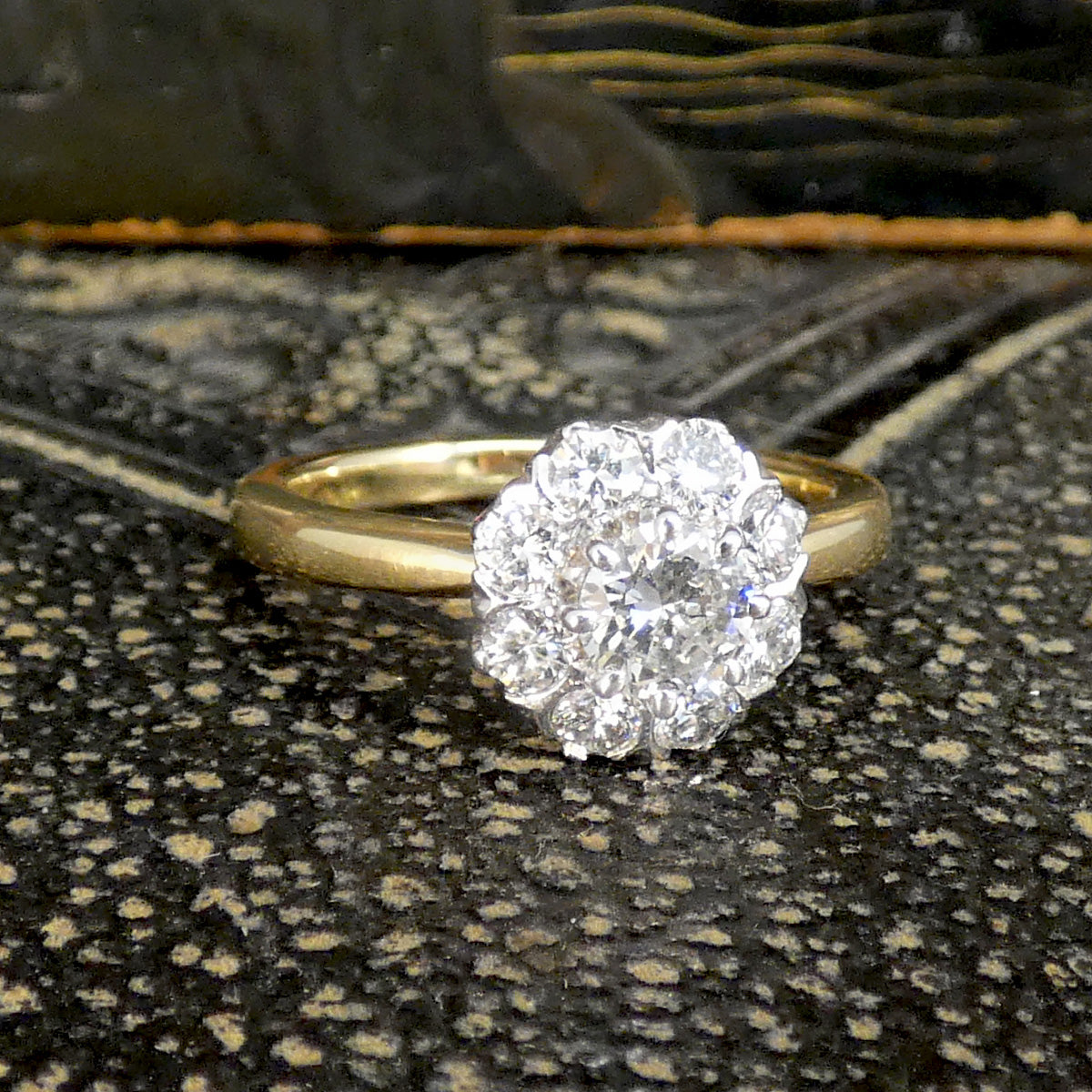 Bright and sparkly vintage early brilliant cut diamond cluster ring in 18ct White Gold with a 18ct Yellow Gold band with slightly tapered shoulders. Holding 0.90ct diamonds and the perfect gift or engagement ring idea for vintage lovers.