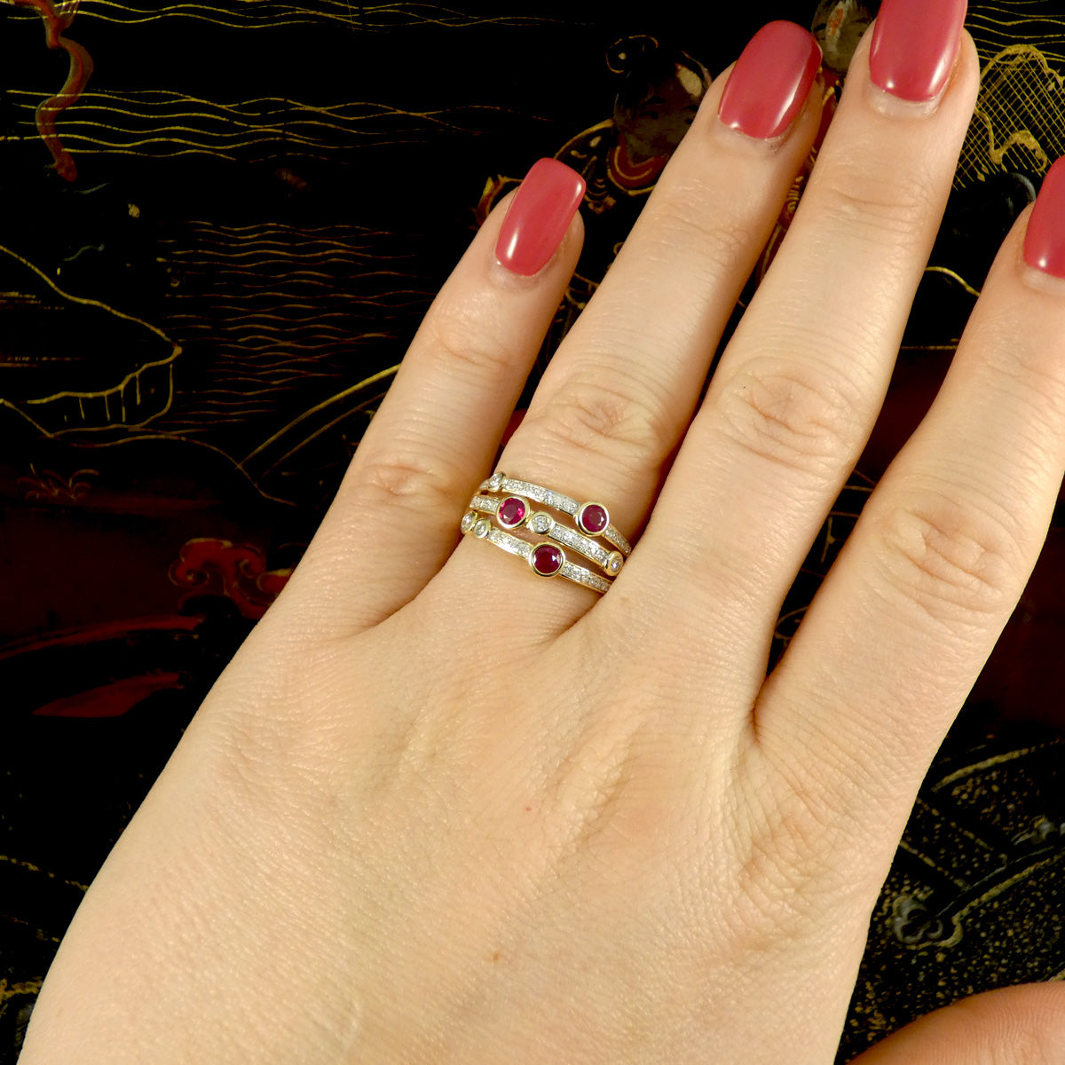 Ruby and Diamond bubble ring shown on the finger demonstrating the size and how it would look to be worn.