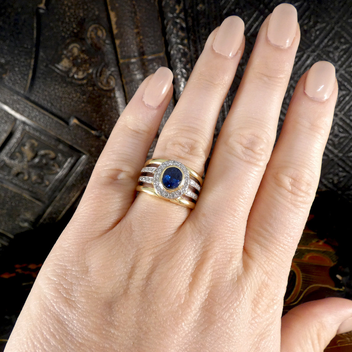Sapphire and Diamond Four Strand Chunky Dress Ring in 18ct Gold displayed on the hand on the ring finger.