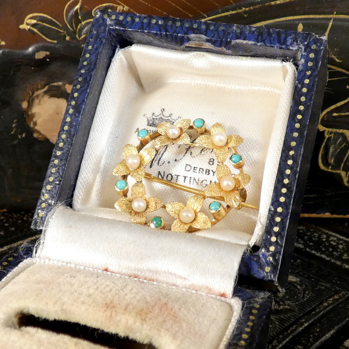 Edwardian Seed Pearl and Turquoise Wreath Brooch in 15ct Yellow Gold displayed in antique box.