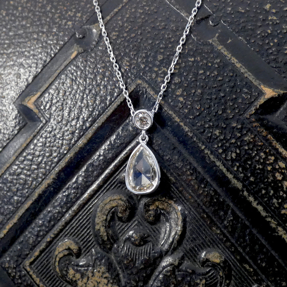 Unique modified rose cut Diamond and brilliant cut drop necklace in 18ct White Gold. Gorgeous and unique shape with over a carat of Diamond weight in total.