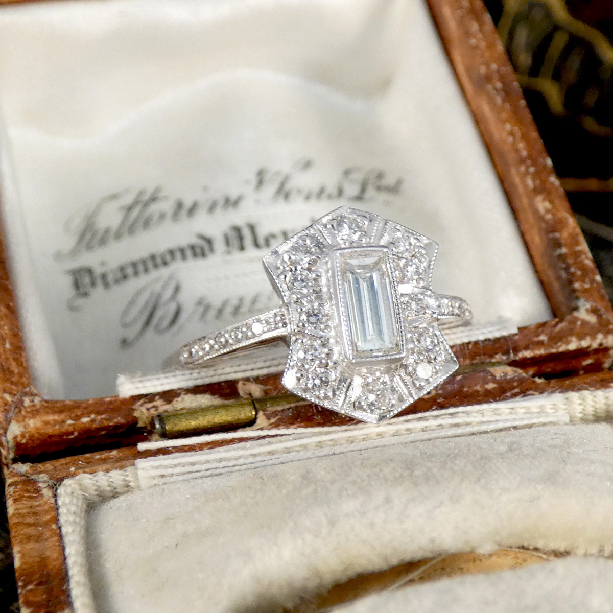 Diamond ring in an open jewelry box with a vintage feel