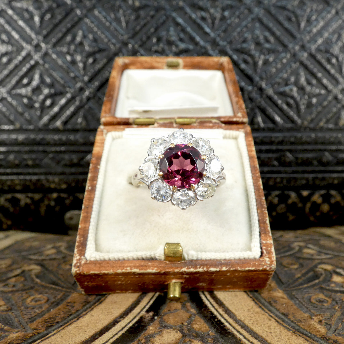 2.00ct Pyrope Garnet and 1.40ct Brilliant Cut Diamond flower cluster ring in 18ct White Gold with Yellow Gold claws on the Garnet.