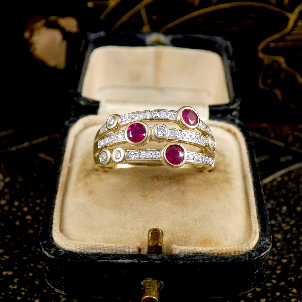 Ruby and Diamond bubble ring set in 9ct Yellow Gold in an antique box from front view with clear and bright contrast between the Yellow Gold and Diamonds.