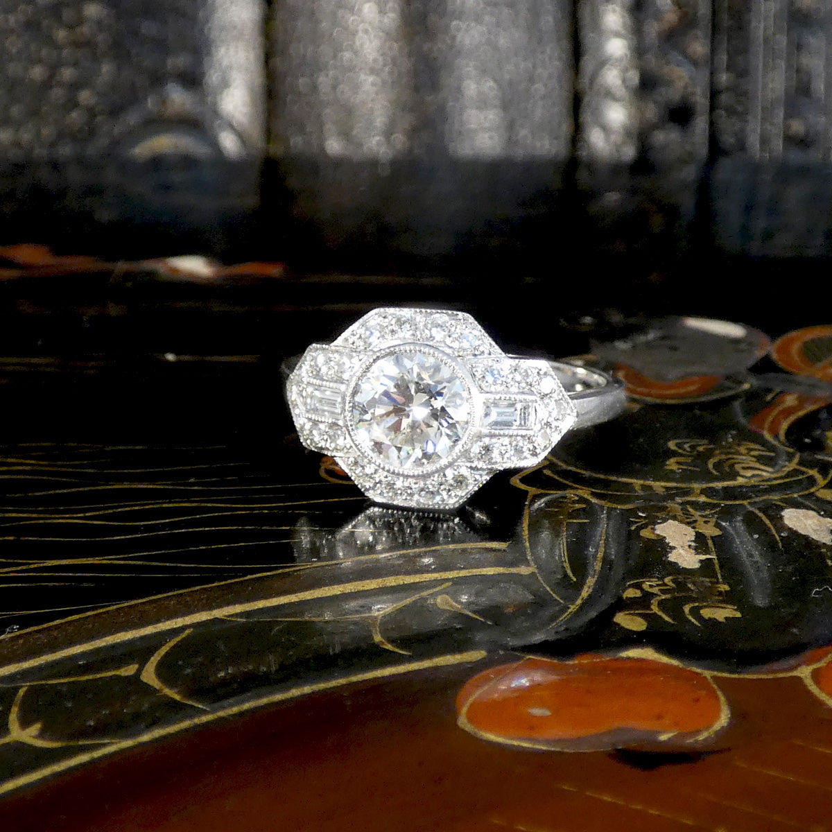 A gorgeous Art Deco inspired Diamond cluster ring in Platinum. The diamonds are displaying as bright and sparkly.