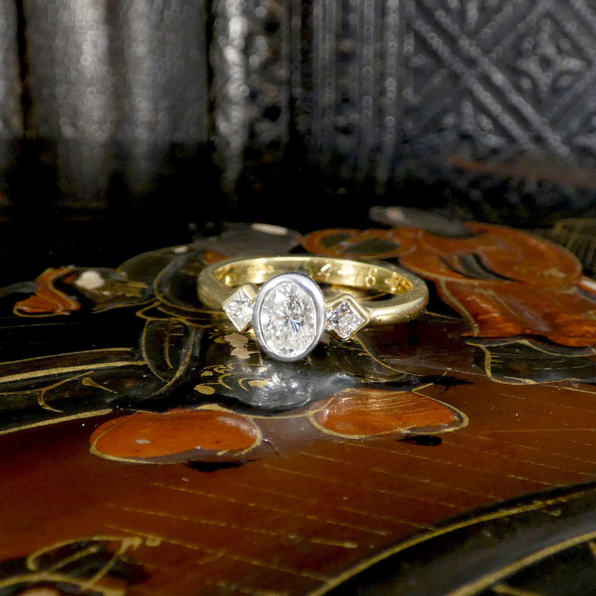 Oval and Princess Cut Diamond Three Stone Ring in 18ct White and Yellow Gold full bezel set.