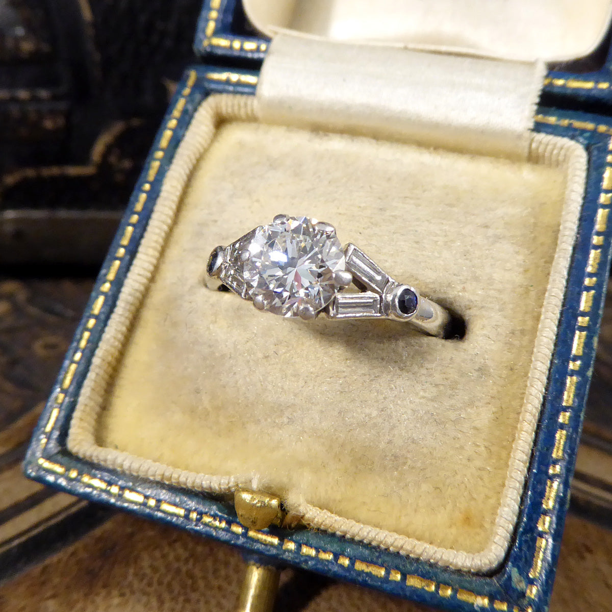Art Deco 1.10ct Diamond Solitaire Engagement Ring with Diamond and Sapphire Shoulders in Platinum - Wharfedale Antiques