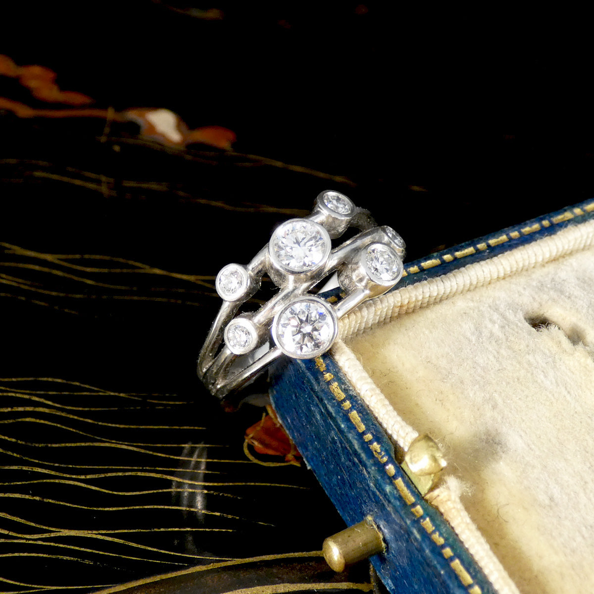 A gorgeous cocktail ring with 0.75ct diamond in bezel settings in platinum.