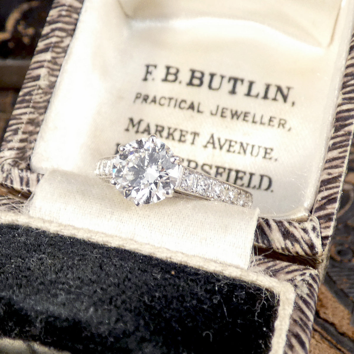 1.30ct Diamond Solitaire with 0.56ct Diamond Set Shoulders in Platinum. High clarity and and near colourless grading, the perfect engagement ring.