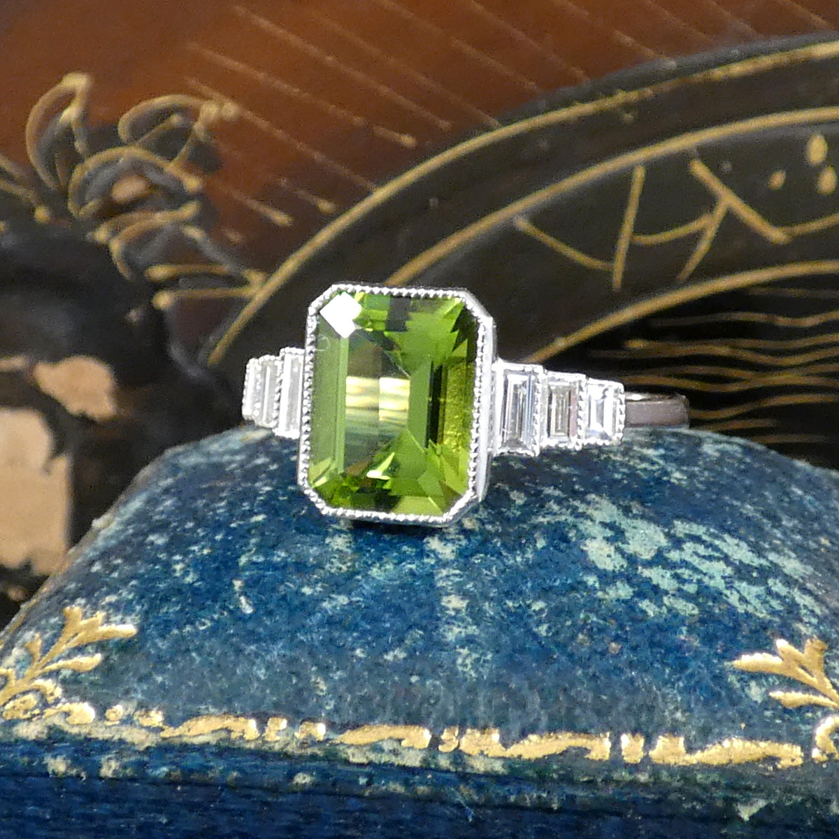 Art Deco Inspired Peridot and Baguette Cut Diamond Staged Shoulders in Platinum. The perfect gift.