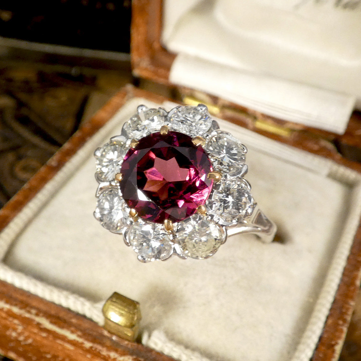 2.00ct Pyrope Garnet and 1.40ct Brilliant Cut Diamond flower cluster ring in 18ct White Gold with Yellow Gold claws on the Garnet. Showing bright and deep colours in a vintage box.