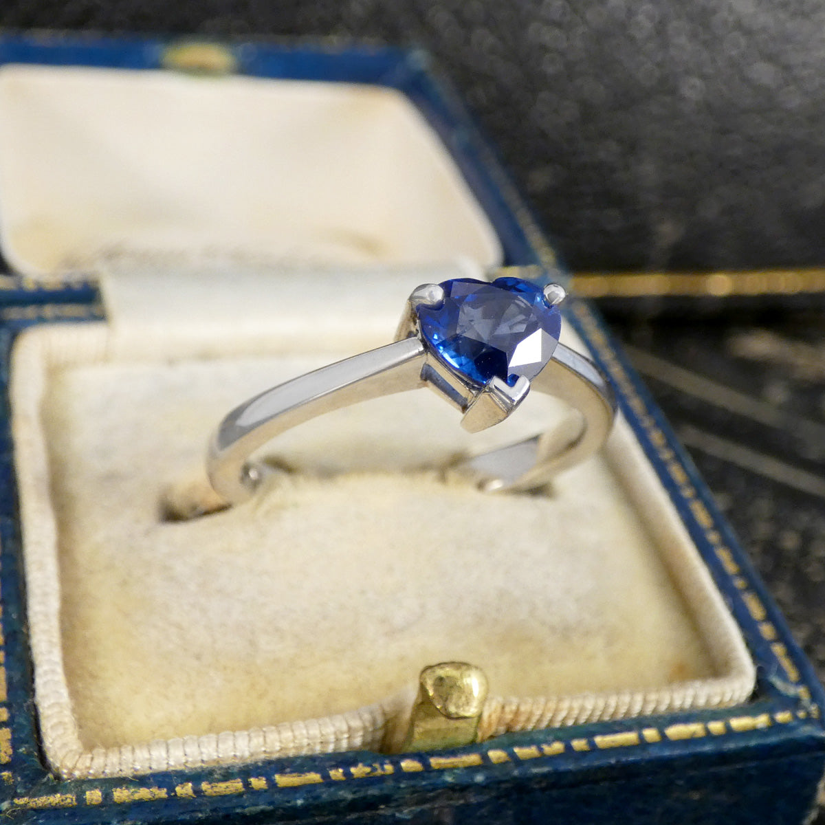 Heart Cut Sapphire solitaire ring in Platinum displayed in the box.