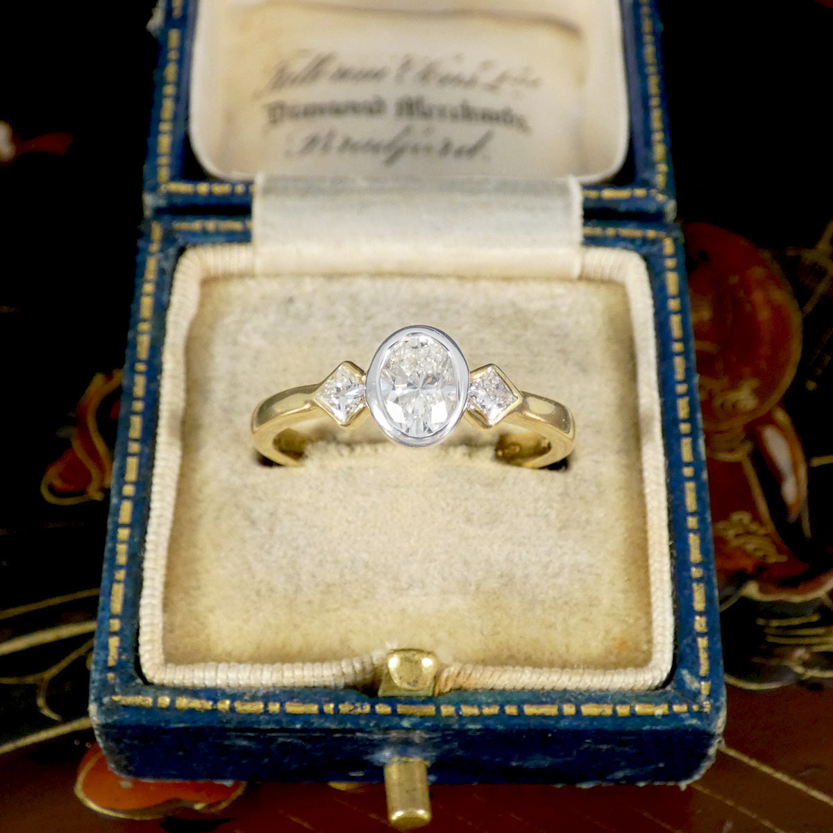 Oval and Princess Cut Diamond Three Stone Ring in 18ct White and Yellow Gold displayed in vintage box.