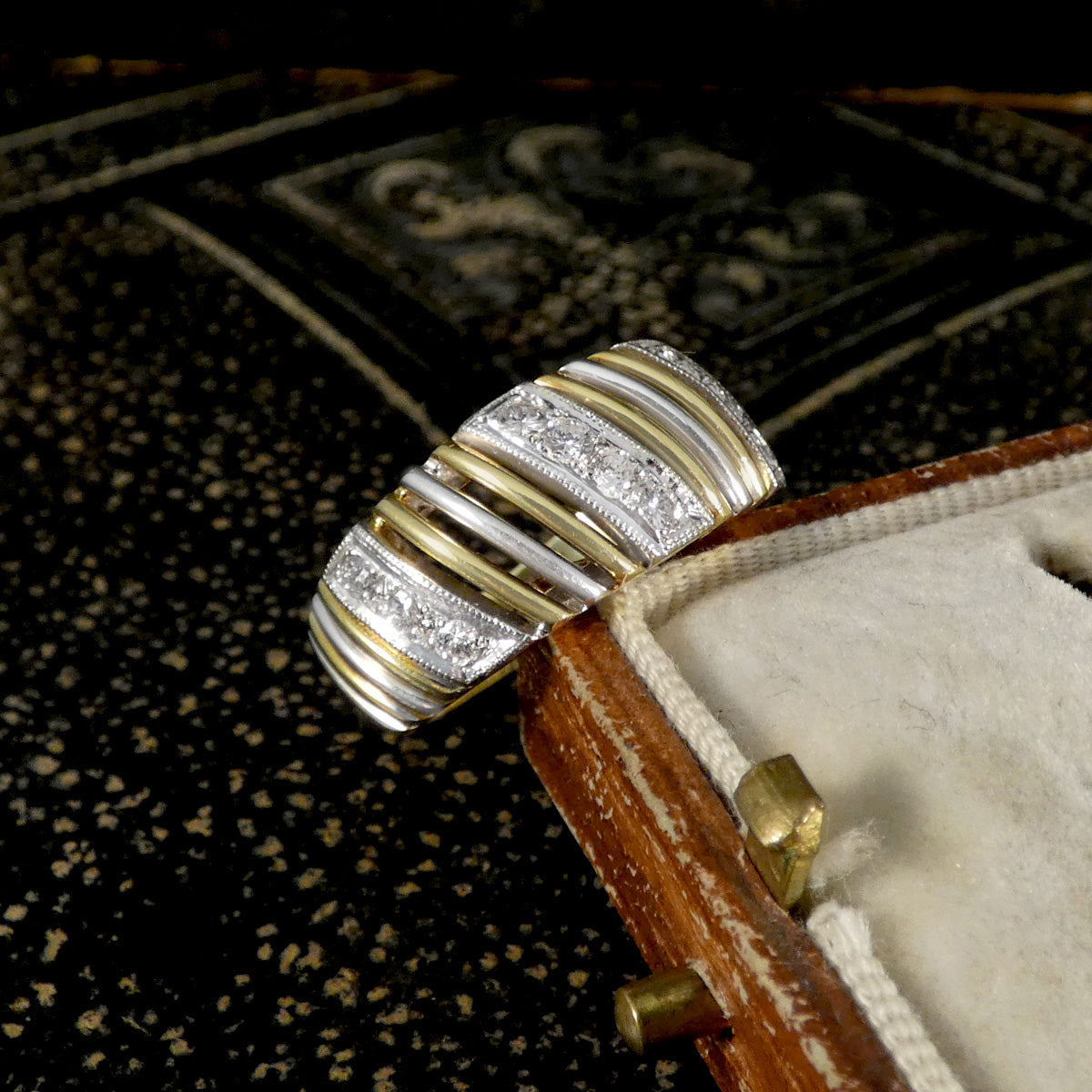 A diamond set gold banded ring