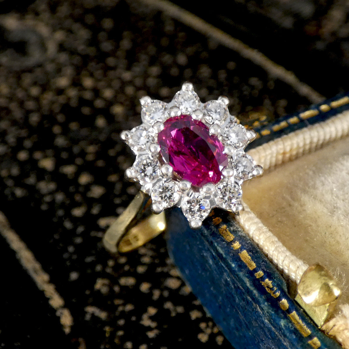 A Ruby and Diamond cluster ring in 18ct white and yellow gold.