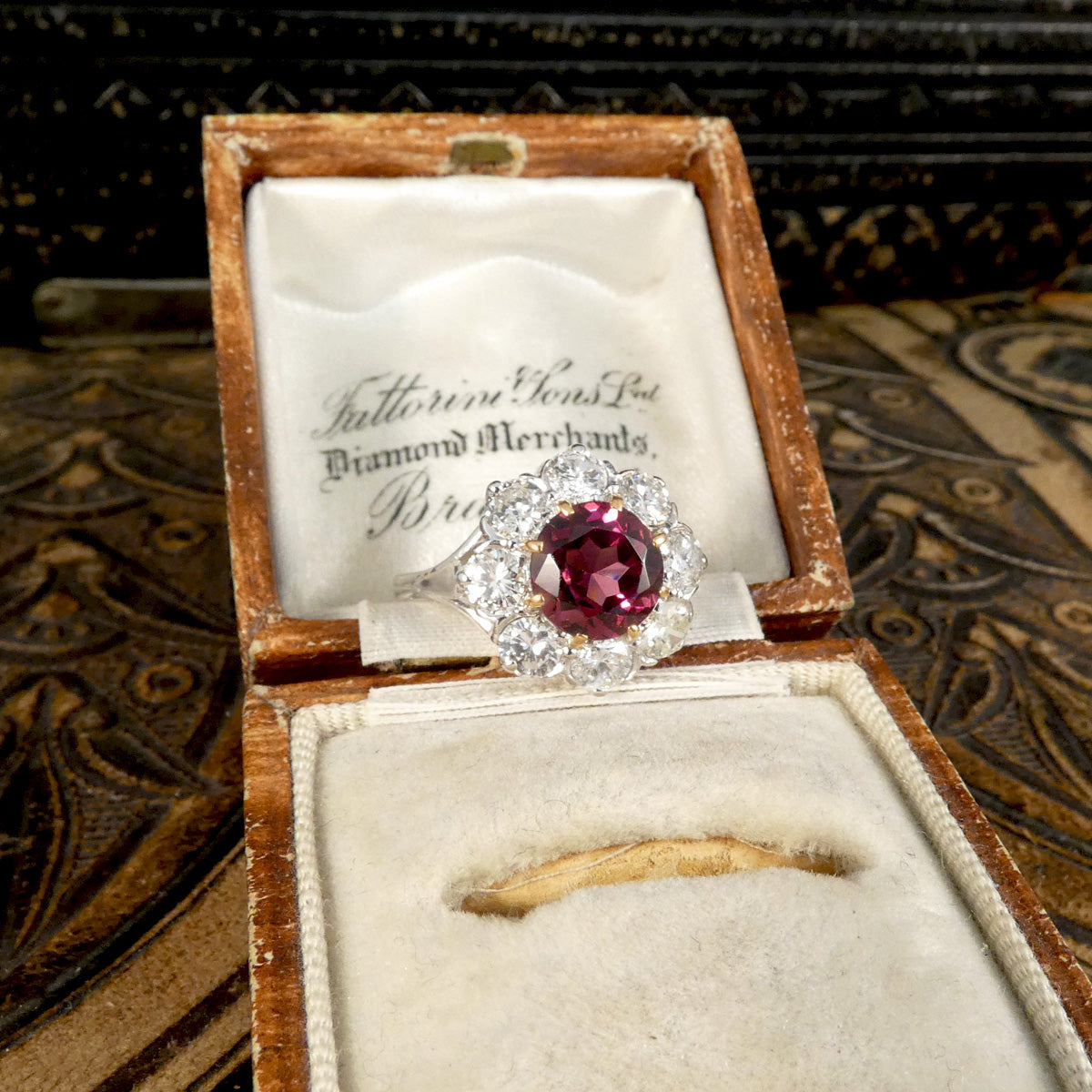 2.00ct Pyrope Garnet and 1.40ct Brilliant Cut Diamond flower cluster ring in 18ct White Gold with Yellow Gold claws on the Garnet. Displayed in vintage box.