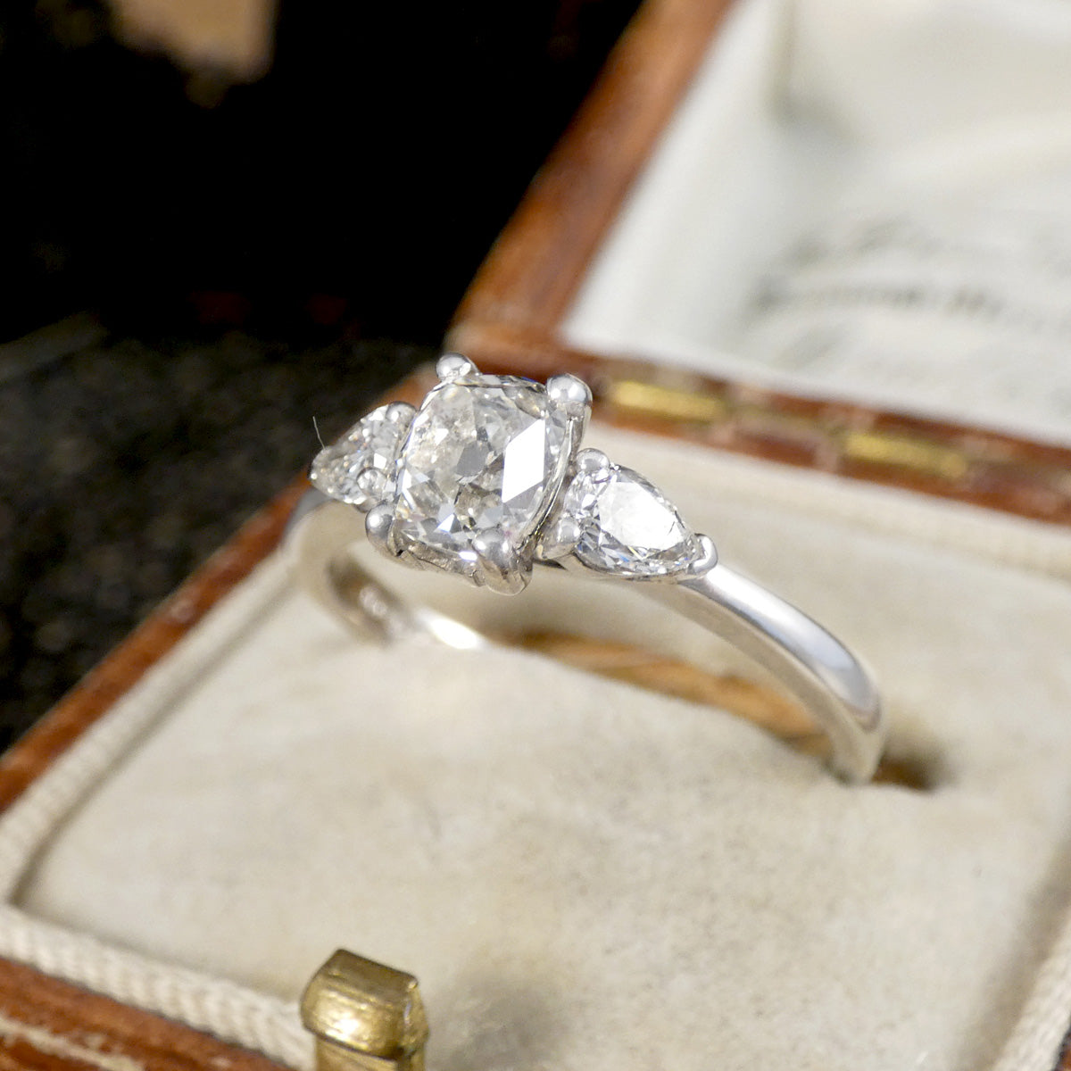 Silver ring with a diamond in an open jewelry box