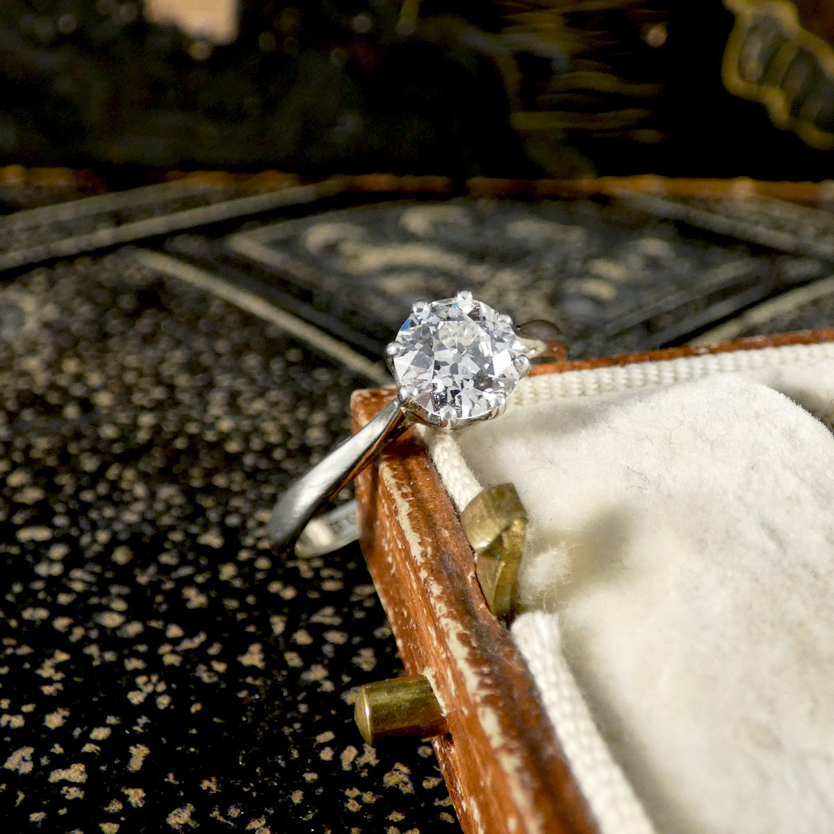 An old cut diamond solitaire ring in 18ct white gold and platinum