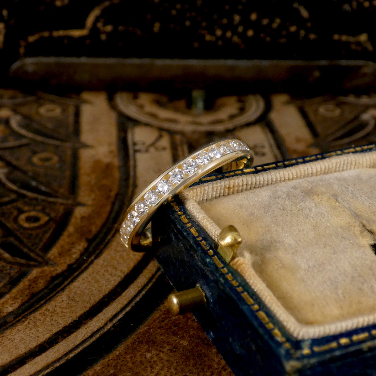 Channel Set 0.54ct Brilliant Cut Diamond Half Eternity Ring modelled in 9ct yellow gold for durability.