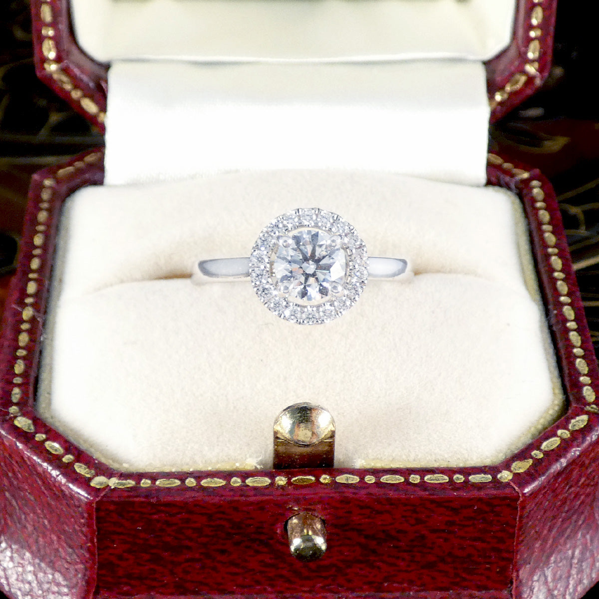 Diamond ring in a red and gold jewelry box