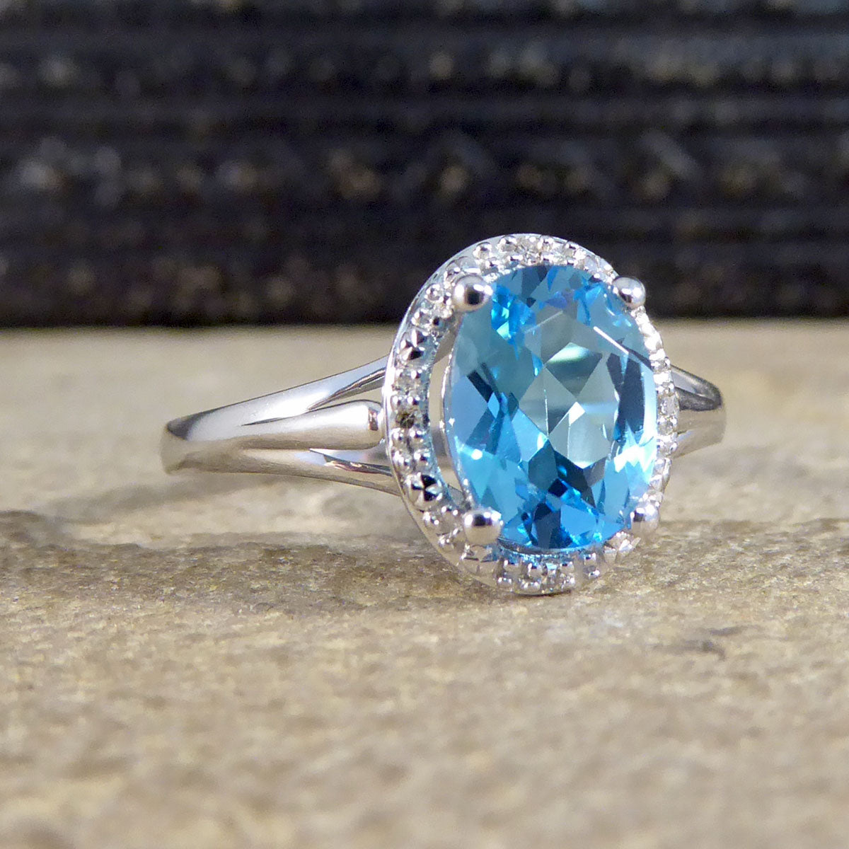 Oval Blue Topaz and Diamond Illusion Halo Cluster Ring in White Gold - Wharfedale Antiques