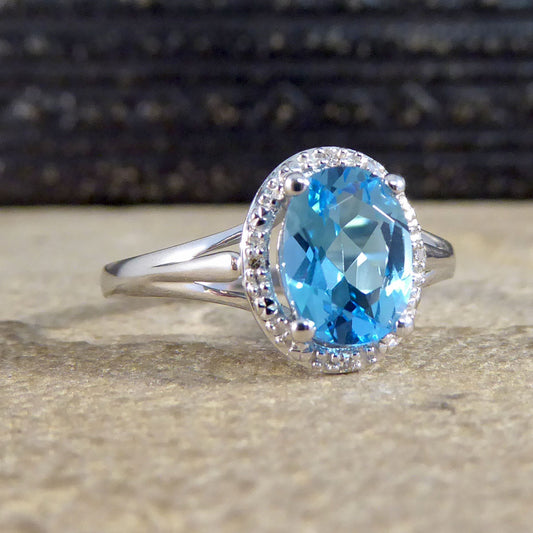 Oval Blue Topaz and Diamond Illusion Halo Cluster Ring in White Gold - Wharfedale Antiques