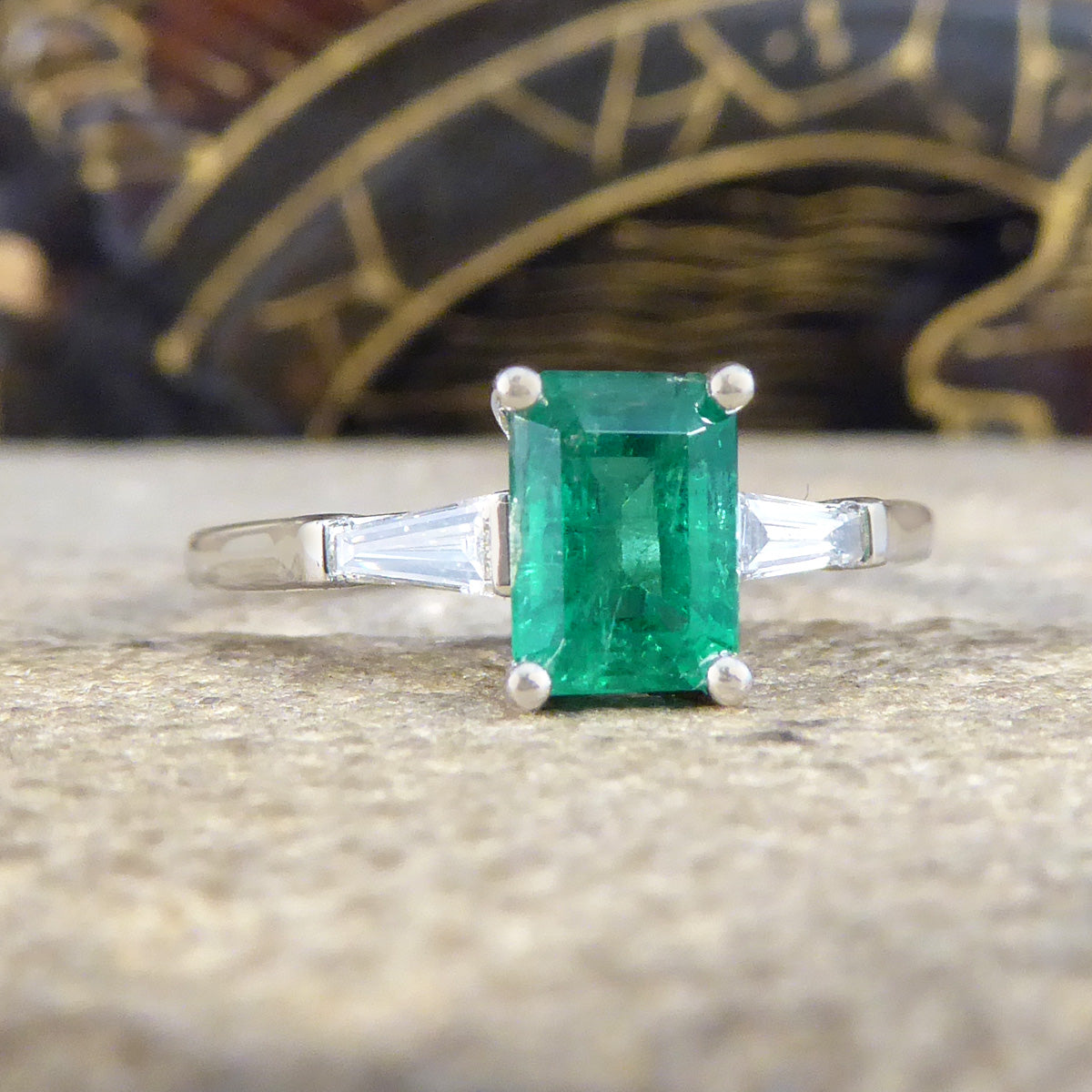 1.03ct Emerald Cut Emerald Ring with Tapered Baguette Cut Diamond Shoulders in Platinum