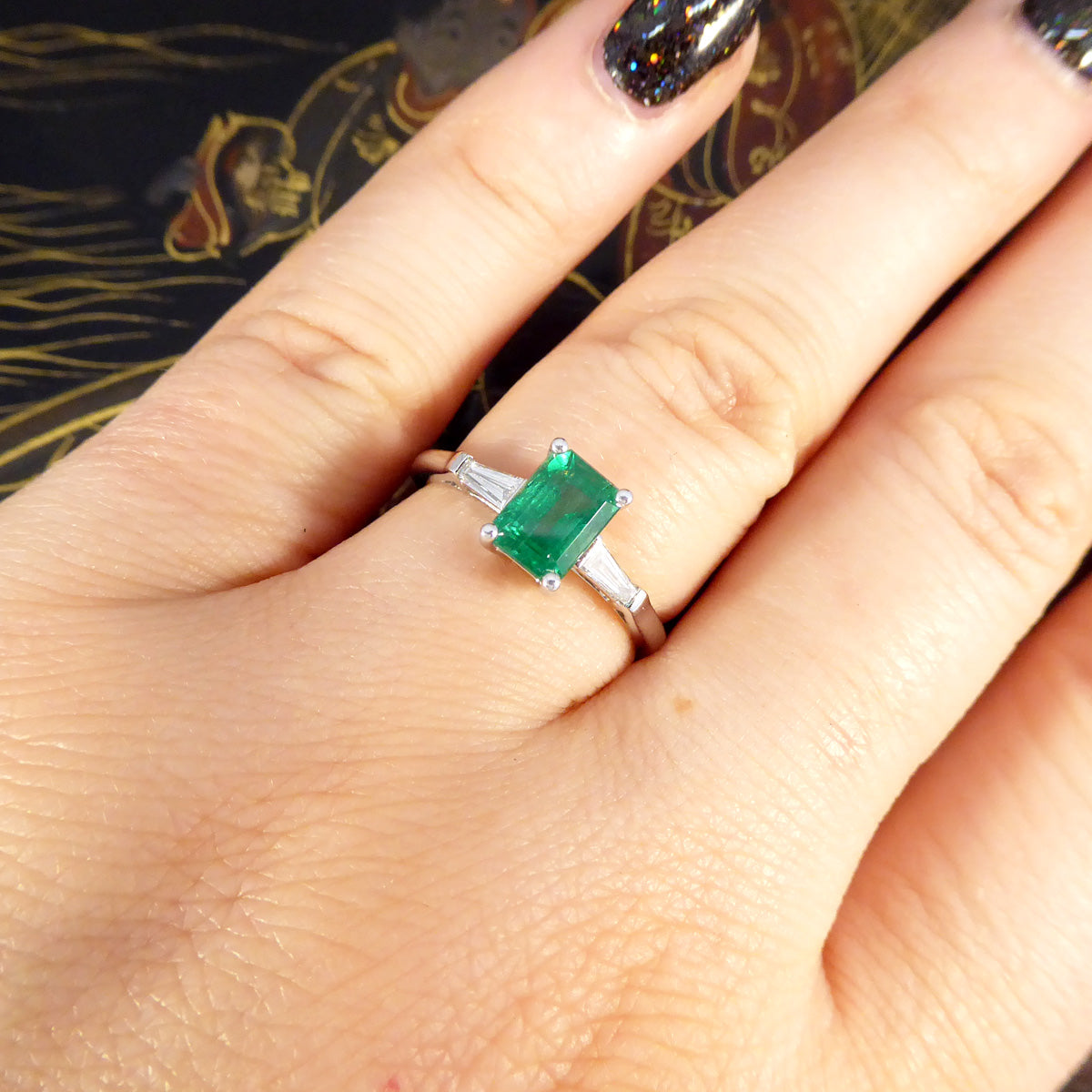 1.03ct Emerald Cut Emerald Ring with Tapered Baguette Cut Diamond Shoulders in Platinum - Wharfedale Antiques