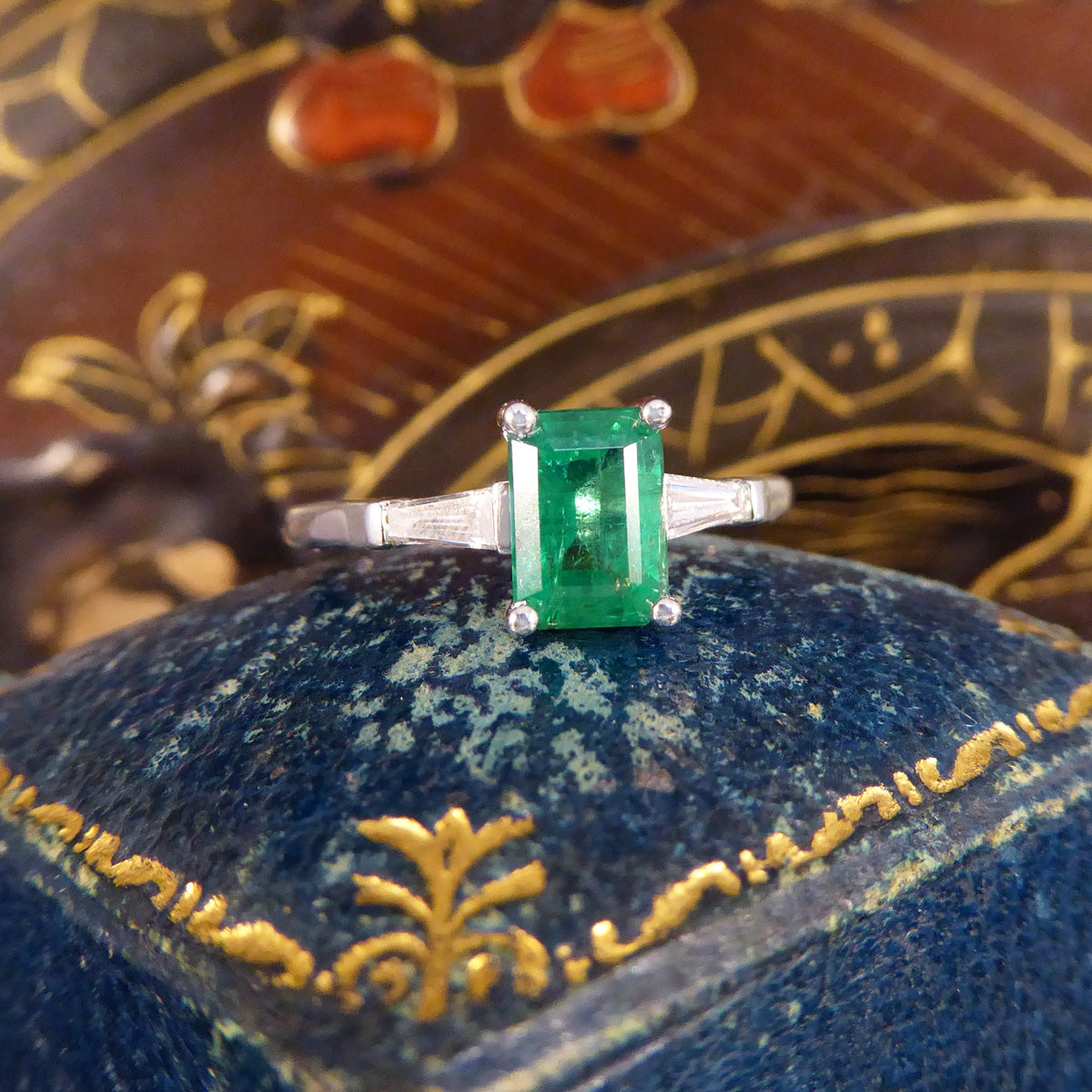 1.03ct Emerald Cut Emerald Ring with Tapered Baguette Cut Diamond Shoulders in Platinum - Wharfedale Antiques