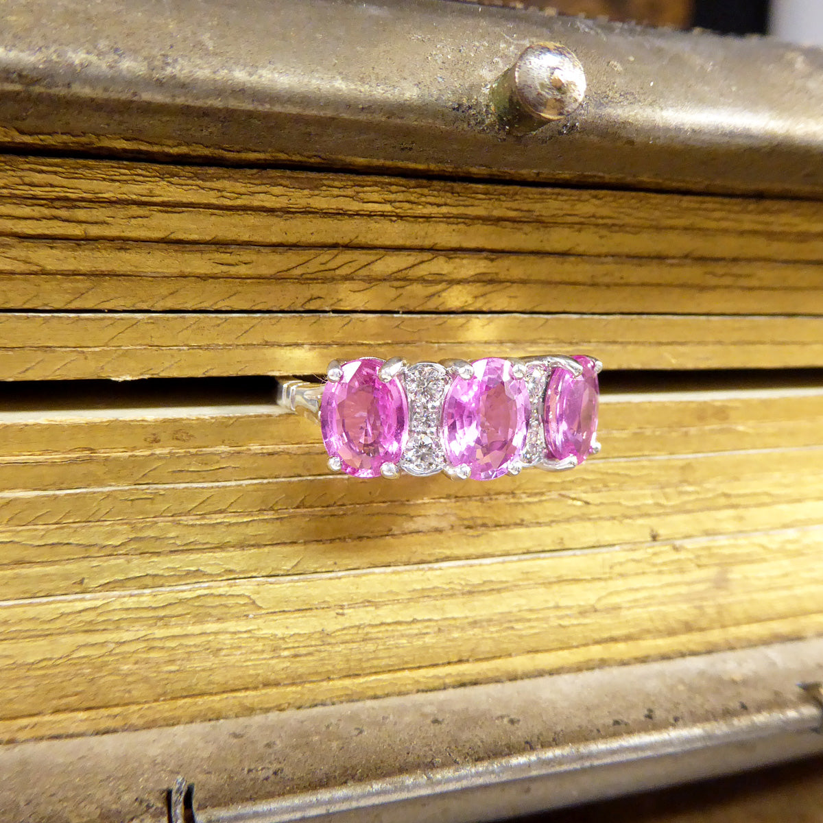 Pink Sapphire Three Stone Ring with Diamond Spacers in 18ct White Gold - Wharfedale Antiques