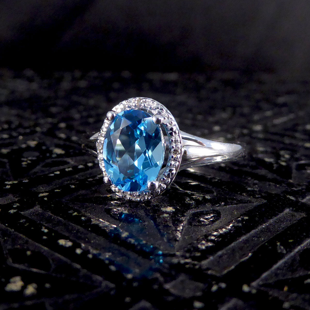 Oval Blue Topaz and Diamond Illusion Halo Cluster Ring in White Gold - Wharfedale Antiques