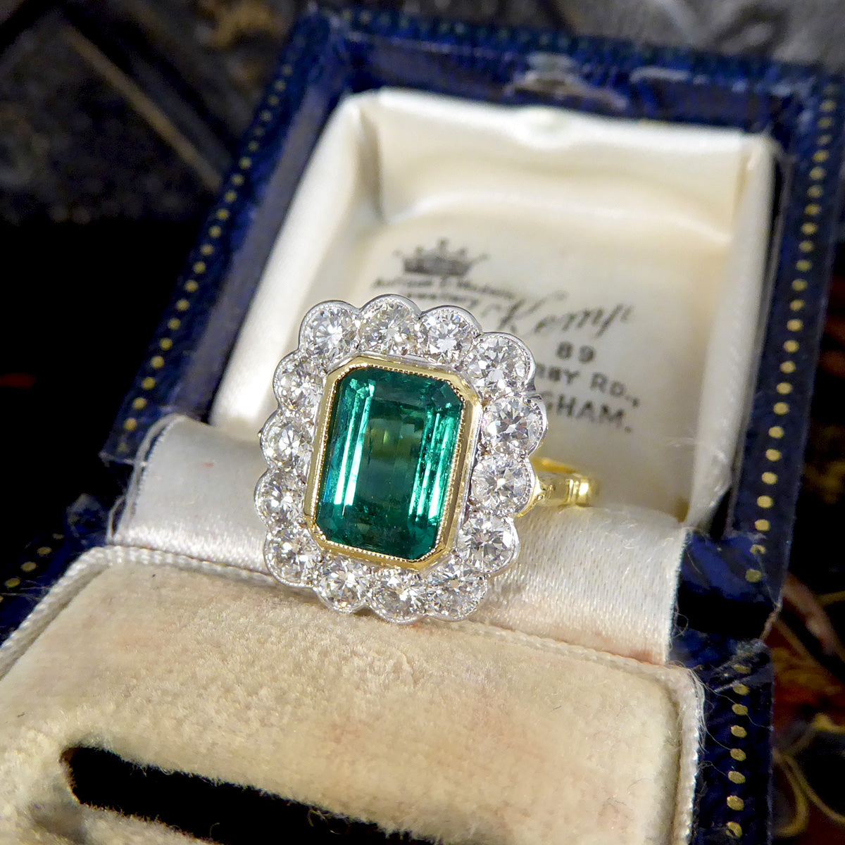 Contemporary Edwardian Style 2.50ct Emerald and 1.20ct Diamond Cluster Ring in 18ct Gold - Wharfedale Antiques