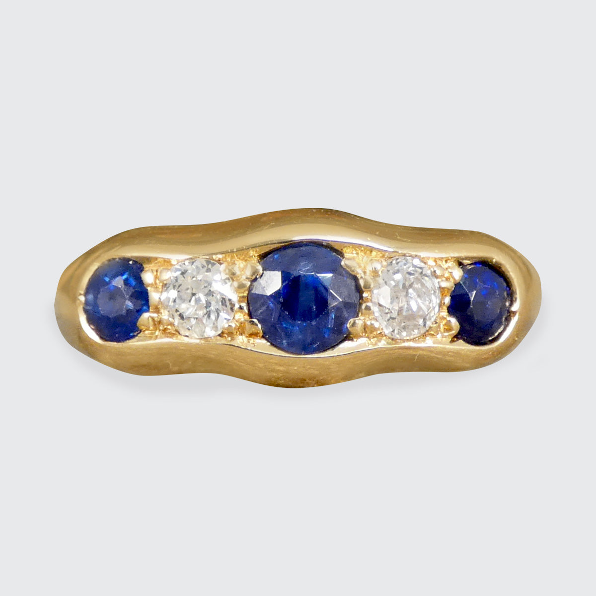 An antique Sapphire and Diamond five stone ring in 18ct yellow gold