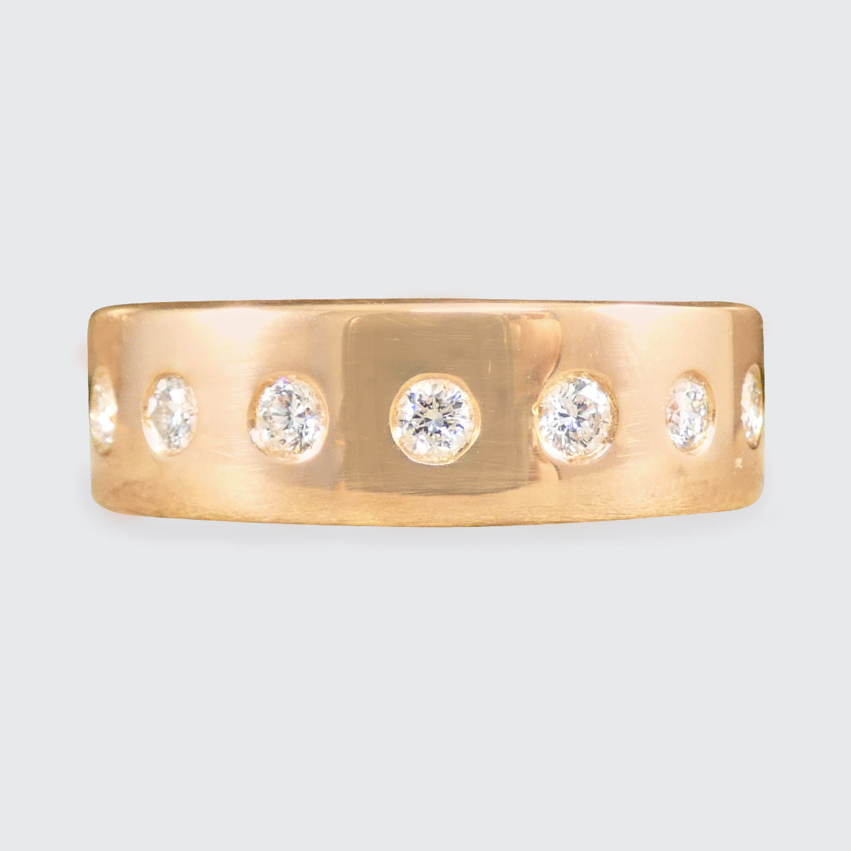 a diamond set dull wide band ring in 18ct rose gold