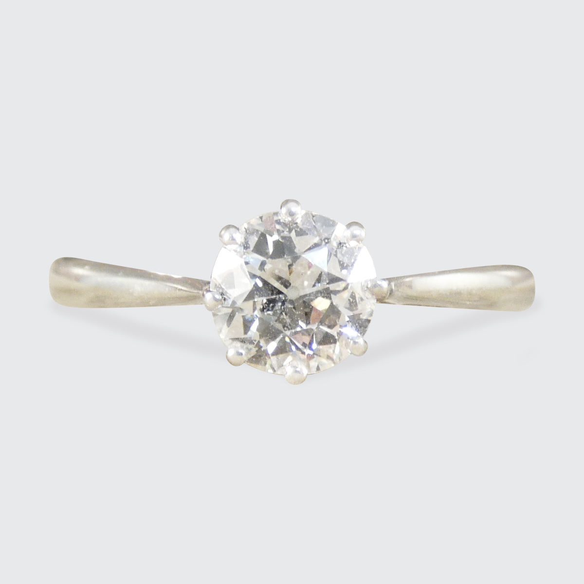 An old cut diamond solitaire ring in 18ct white gold and platinum