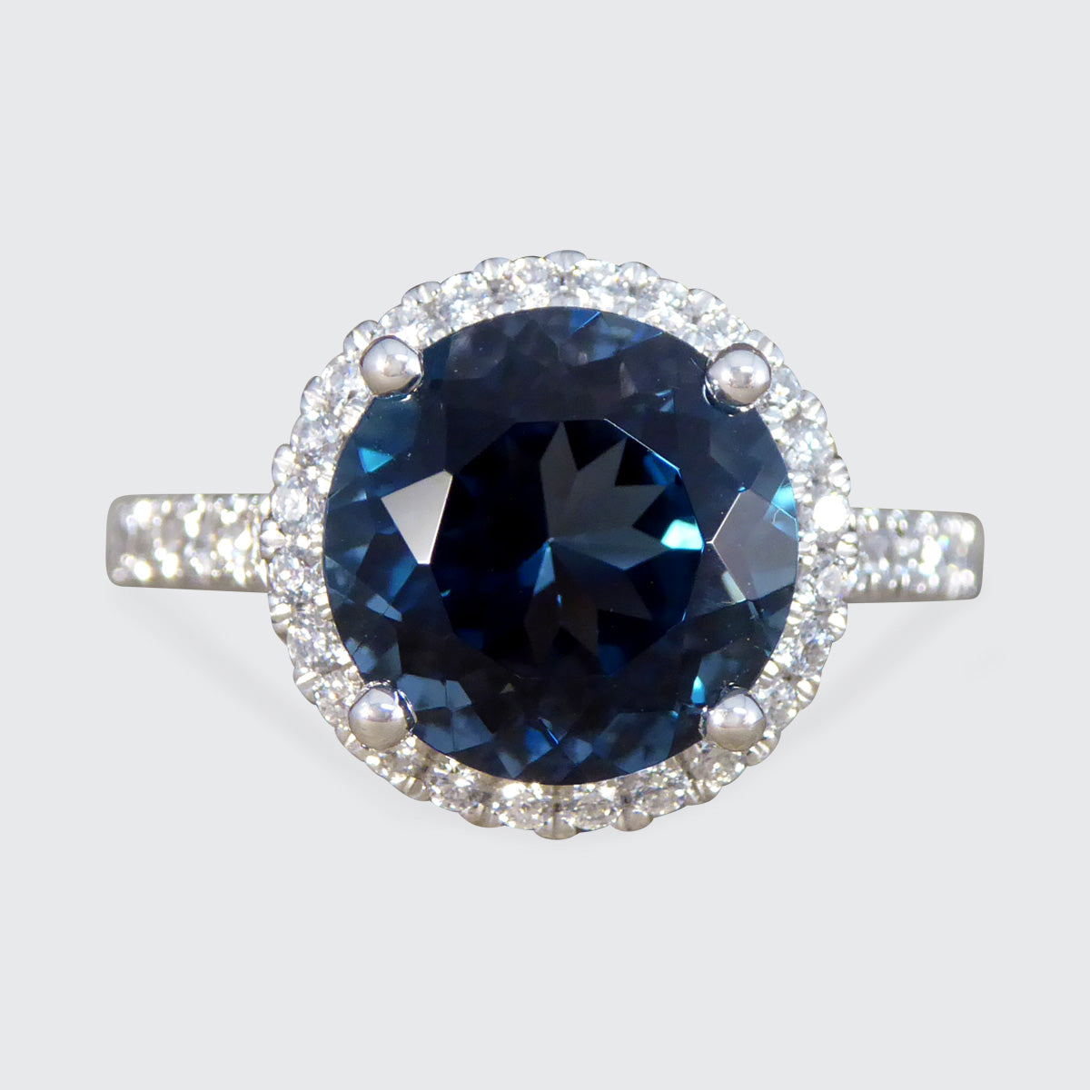 London Blue Topaz and Diamond Halo Cluster Ring in Platinum with Diamond set Shoulders - Wharfedale Antiques