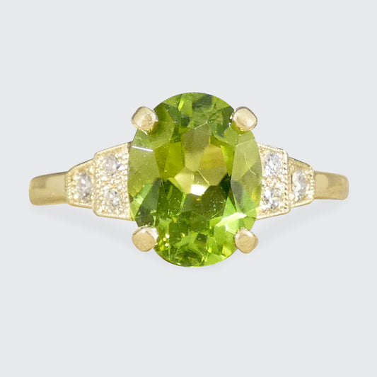 An antique style peridot and Diamonds ring in 9ct Yellow Gold.
