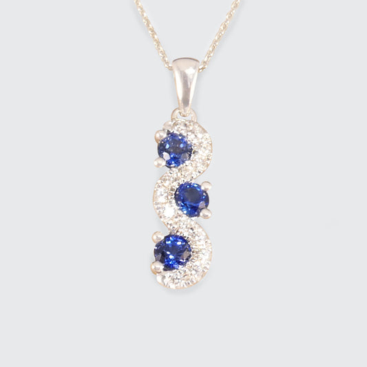 Ceylon Sapphire and Diamond Three Stone Lazy River Drop Pendant Necklace in Platinum - Wharfedale Antiques