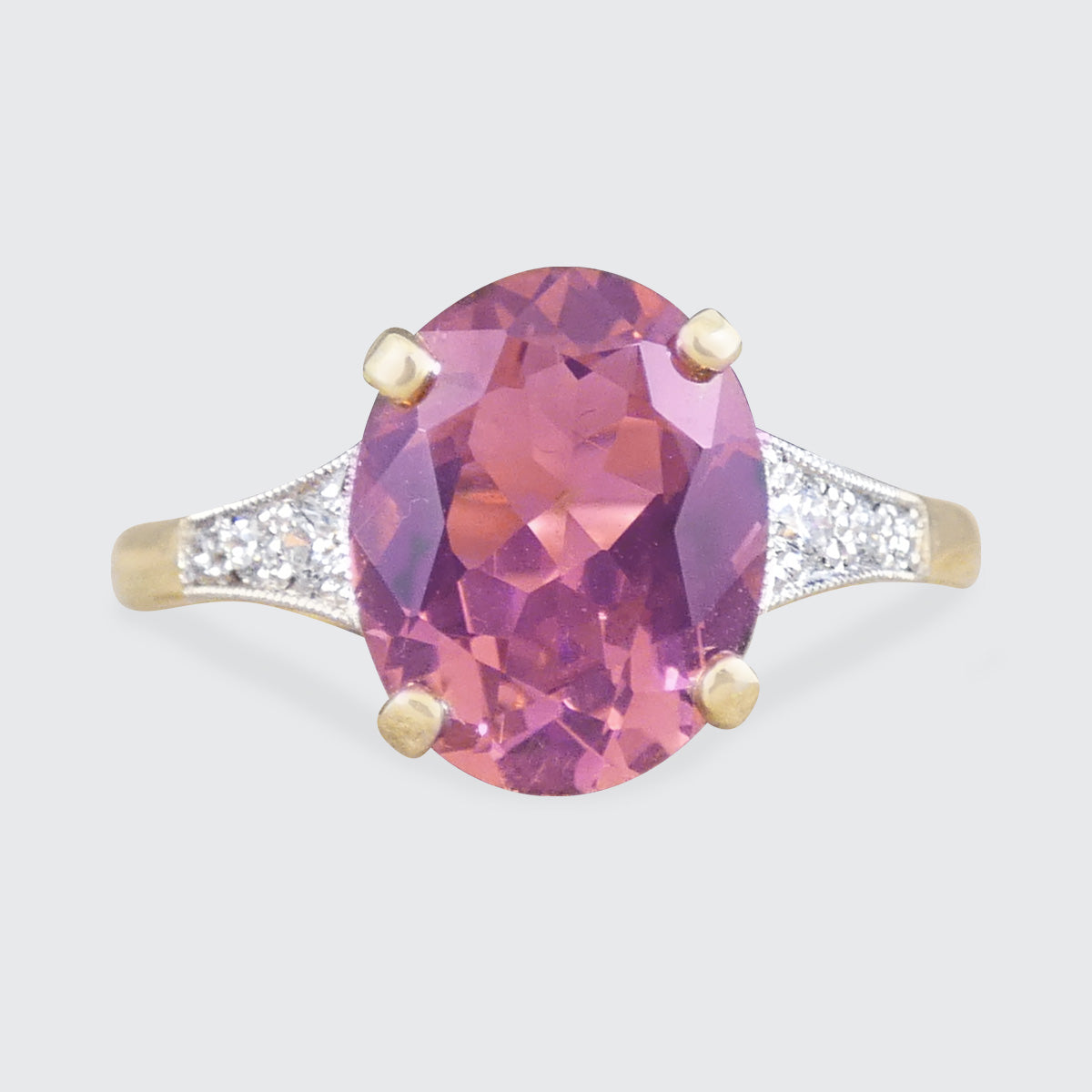 Art Deco quality replica ring featuring a Pink tourmaline centre with diamond set shoulders in 18ct Gold.