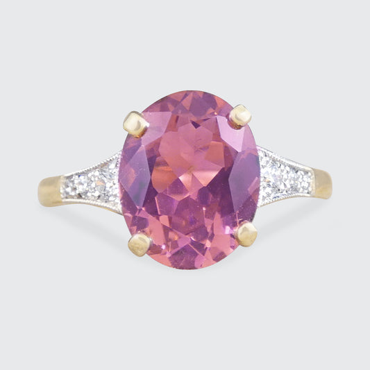Art Deco quality replica ring featuring a Pink tourmaline centre with diamond set shoulders in 18ct Gold.