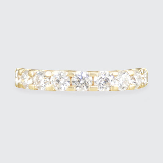 A diamond set half eternity ring in yellow gold