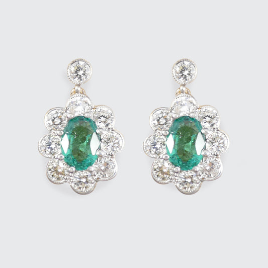 Emerald and Diamond cluster drop earrings in 18ct yellow and white gold.