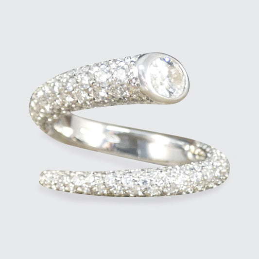 A diamond set torque ring with an oval cut diamond end