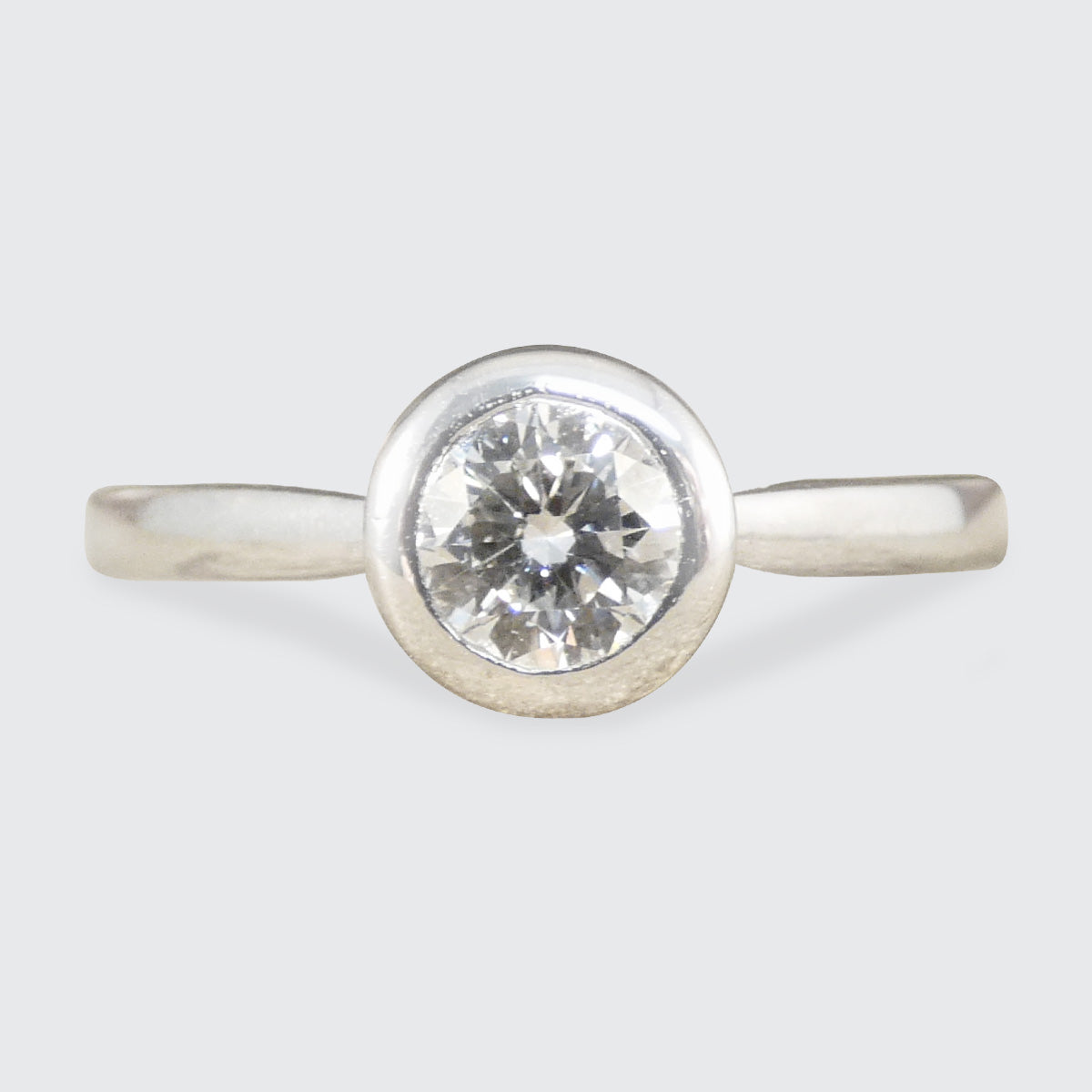 Diamond Solitaire Wedfit Ring in a Rub Over Bezel with a Diamond set Profile
