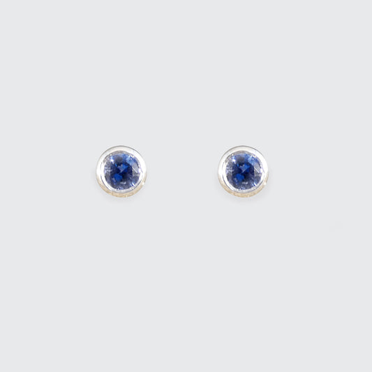 A pair of blue sapphire stud earrings in white gold.